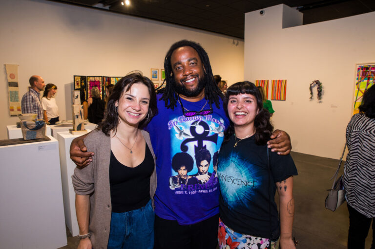 Ariel Wills, Charles Lee and Laura Medina are smiling and posing for the camera.